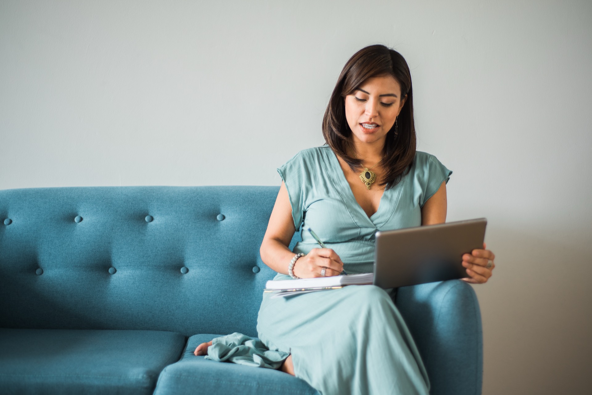 Provider reviewing client journal on tablet